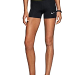 Athletic woman wearing Nike shorts and shoes.