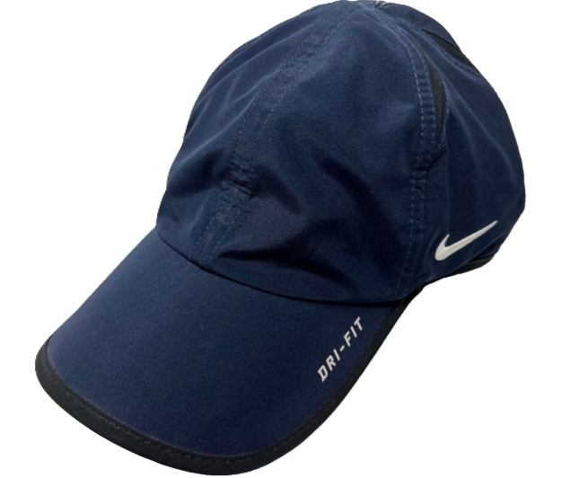 Navy blue Dri-FIT cap with logo.
