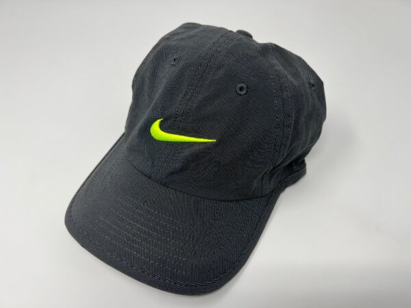 Black Cap with Neon Nike logo on display