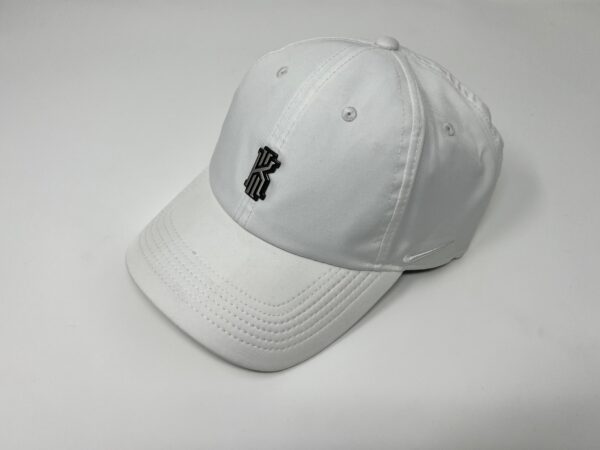 White Cap with black batch on display