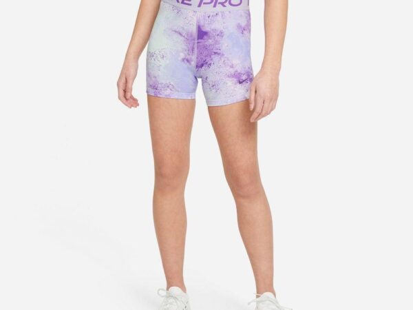 Woman in purple athletic wear standing.