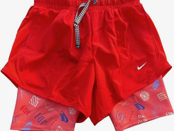 Red athletic shorts with printed inner layer.