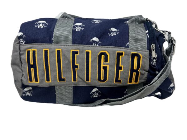 Blue and gray duffel bag with skulls.