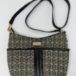 Patterned handbag with black strap and trim.