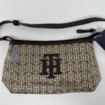 Beige patterned handbag with logo design.