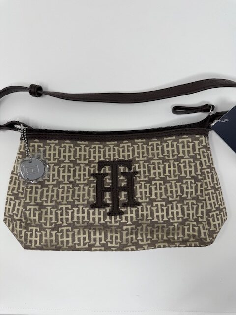 Beige patterned handbag with logo design.