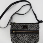 Patterned crossbody bag with zipper and strap.