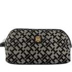Geometric-patterned toiletry bag with logo emblem.