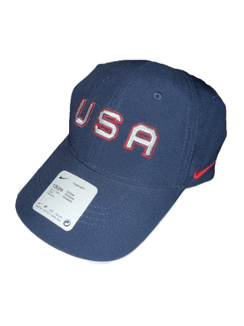 Blue cap with "USA" and Nike logo.