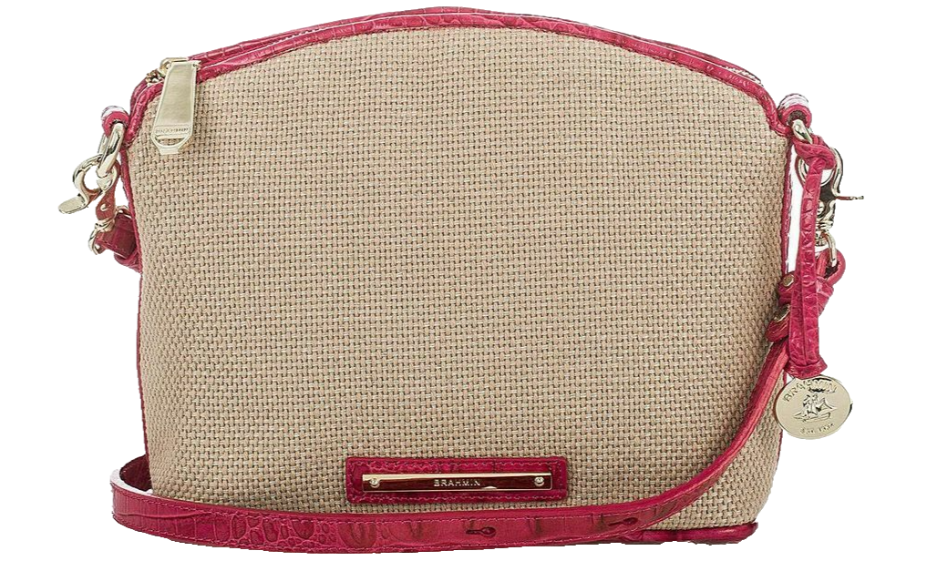 Beige handbag with pink accents and strap.