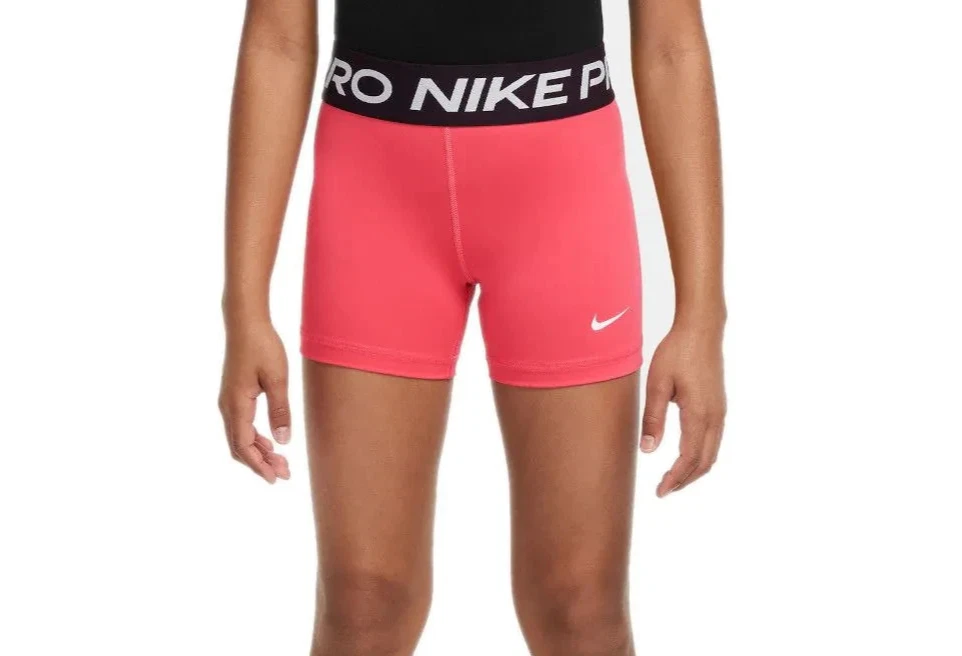 Person wearing red Nike athletic shorts.