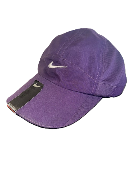 Purple Nike cap with logo and tag.